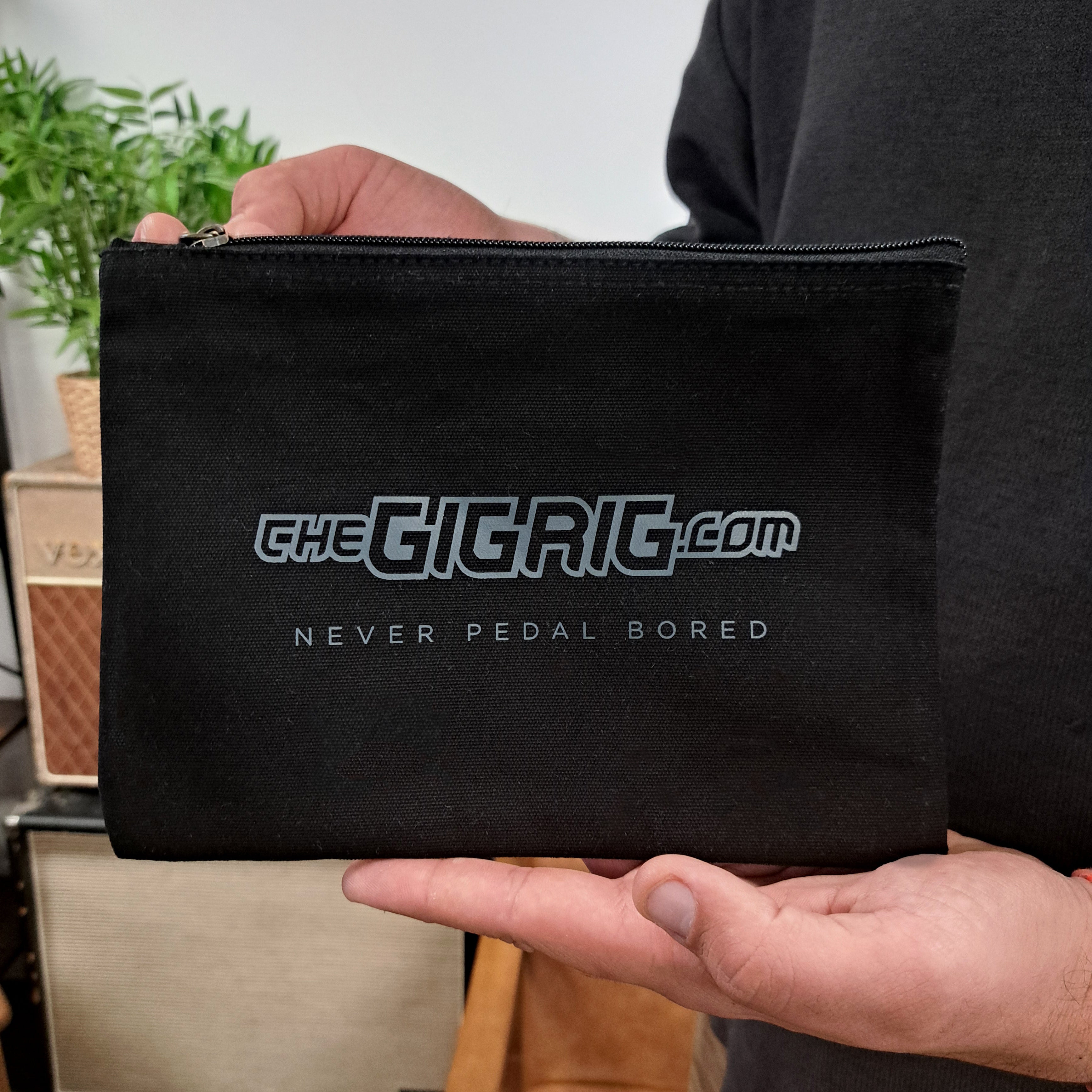 The GigRig organic cotton accessory pouch held in hands